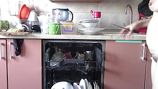 Naked sexy wife preparing food in the kitchen. Hairy brown hair, big ass, big tits.
