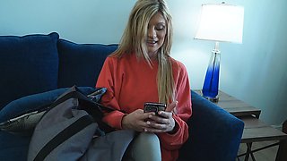 Blonde Ellie moans while gently fingering her sensitive clit