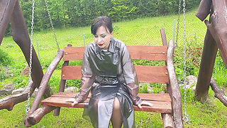 Raincoat, nylons and bra with open nipples