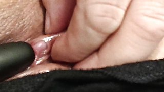 Stimulation of the clitoris with a silver toy