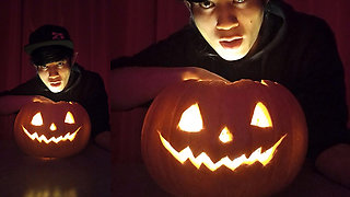 SFW Jon Arteen cute twink emo femboy carves a Halloween pumpkin in his underwear Jack-o'-Lantern