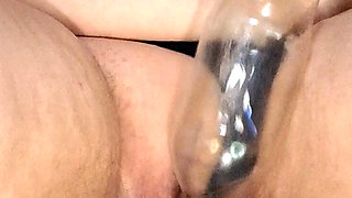 Masturbating my clit with plastic bottle.