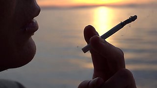 Smoking Cigarettes on the Beach
