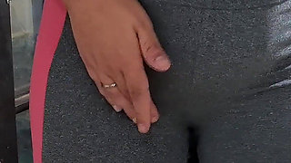 Masturbating Her Camel Toe on the Table with the Neighbor's Help