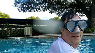 Couple Underwater Diving and Swimming