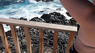 Sexy girl in beachwear at public beach lookout point handjob