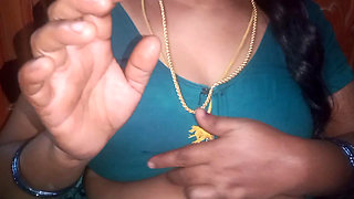 Tamil aunty squeezing her breasts when she is alone and unable to control her emotions.