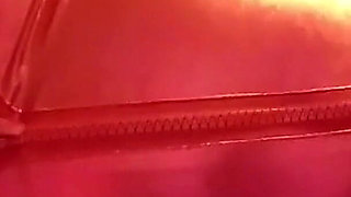 Cougar MILF in a hot red metallic catsuit with huge tits out for play