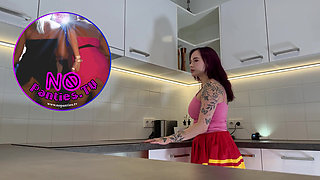 Hottest redhead tattooed cheerleader with over knee socks shows her see through panties in the kitchen
