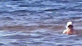 Funny Mommy Has Fun on the Beach with Young Guys