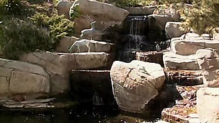 Platinum blonde bimbos having fun with strapon by the pool