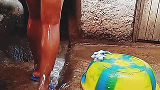 Outdoor bathing my pregnant girlfriend in dirty environment.