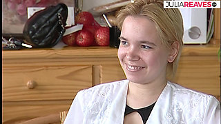 Shy blonde looks down while chatting with lover