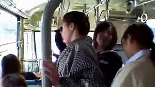 Girls grope mature milf in kimono in the bus