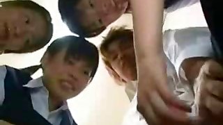 Japanese schoolgirls are teasing and playing with guy's cock