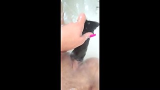 MILF Plays in the Tub with a Big Dildo