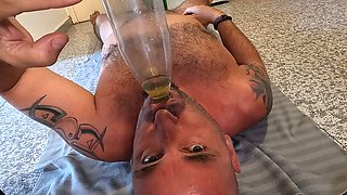 Husband Lying on His Back Drinking Piss & Cum Through a Funnel