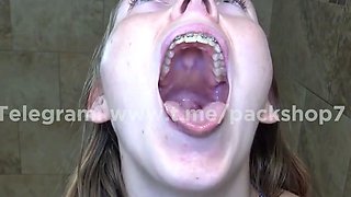 Evil white woman devours live fish in bathroom - vore giante