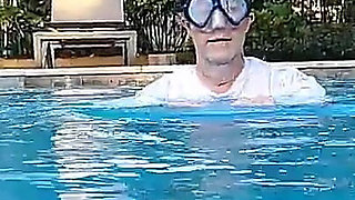 Couple Underwater Diving and Swimming