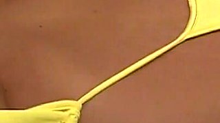 Horny wife indianna jaymes exposes her huge boobs in yellow sling thong bikini