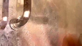 Busty amateur milf masturbates in the shower