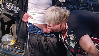 A neighbor holds my dick while I pee and then sucks it in public