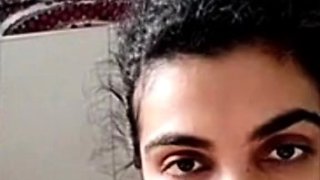 Busty indian milf strips nude to show round tits on webcam