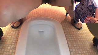 Hairy pussy asians piss into public toilet