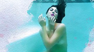 Petite latina MILF Brett Barletta dips her luscious body naked in a pool