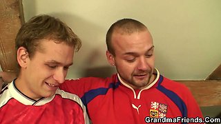 Skinny blonde granma swallows two cocks at once