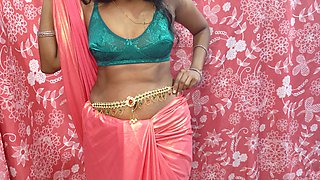 Desi Hot Bhabhiji Wearing Pink Saree in the Bedroom