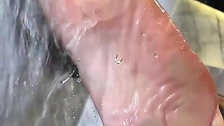 Sexy Wet Bare Foot Pressed Against Glass in Shower