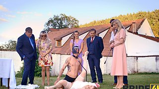A hot bride is getting fucked outdoors by her husband in a steamy scene