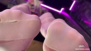 Under the Feet of the Mistress in White Pantyhose on the Bar Counter