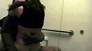 Big-Titted Black Amateur Has Interracial Sex in a Public Bat