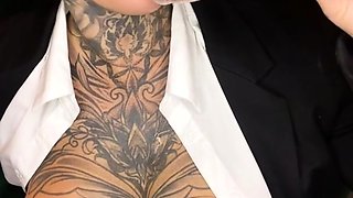 Tattooed milf gives a hot POV handjob and plays with herself