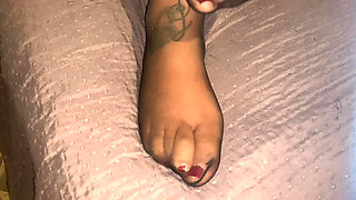 Feet in pantyhose and red nail polish for a super cumshot