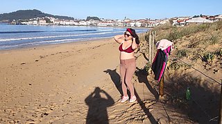 Woman Pissing on a Public Beach While No One Is There