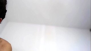 Teen brunette toys pussy and sucks dick in bath