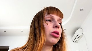 Redhead teen mistress makes her slave swallow her spit