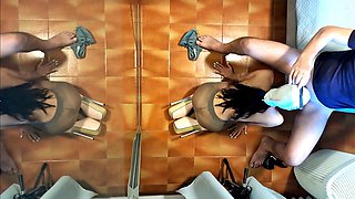 Naked milf in pantyhose and heels gives a blowjob while sipping a drink