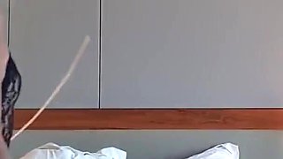 Asian Dominatrix Punishing Slave with Whip