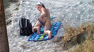 Ashlyn Lee goes fishing, but she would rather enjoy a masturbation session on the sand. She gets caught on-camera by our voyeur videographer.