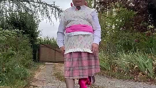 In a gardener outfit with a pink dress for a day