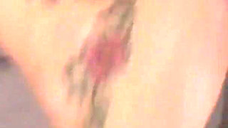 Newly grown up Dani Jensen slut with smooth pussy and tattooed skin spreads her legs to get her pussy stretched