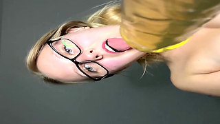 A Sexy Blonde Wearing Glasses Orgasms Over the Camera