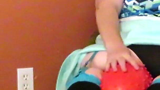Nurse Vicki plays with a rubber ball in a mini skirt, sexy stockings and high heel mini boots