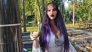 Gothic Witch Wanders the Cemetery, Performs Black Magic Rituals, and Makes You to Worship Her and Satan.