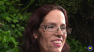 Skinny MILF gags on black pecker