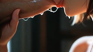 Black bob haired girl deepthroats cock in dim window room